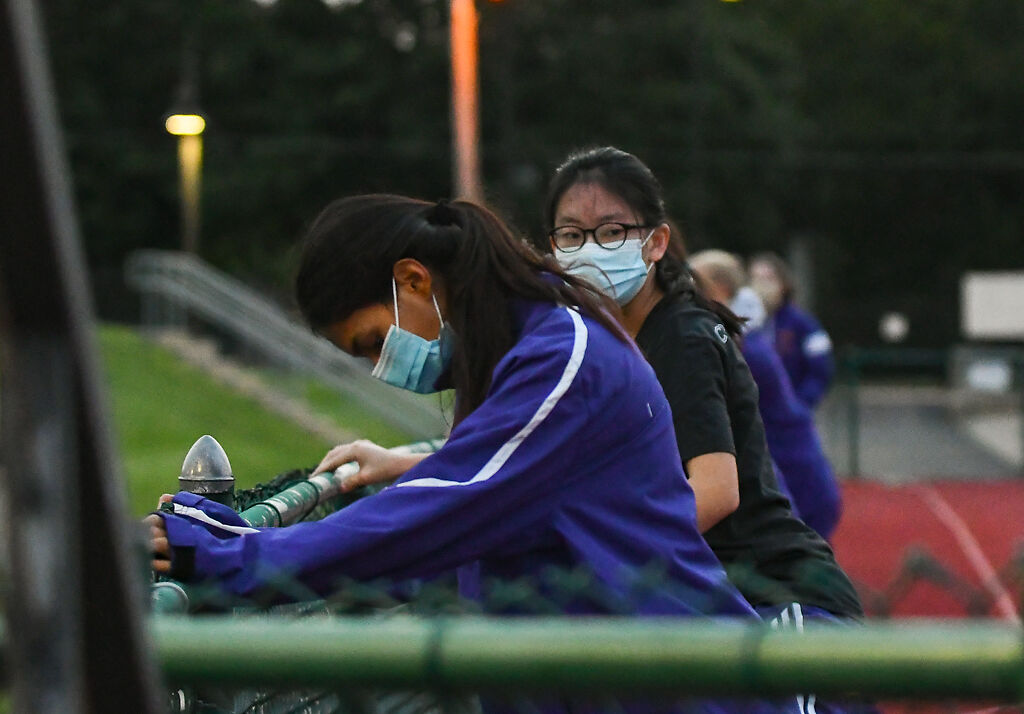 Isabella Laird and Taehee Oh warm up for the race